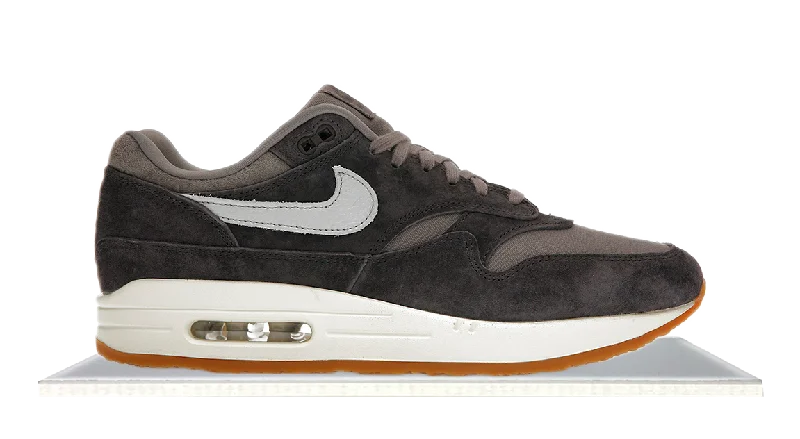 Men's black canvas sneakers with a red soleAir Max 1 Crepe Soft Grey